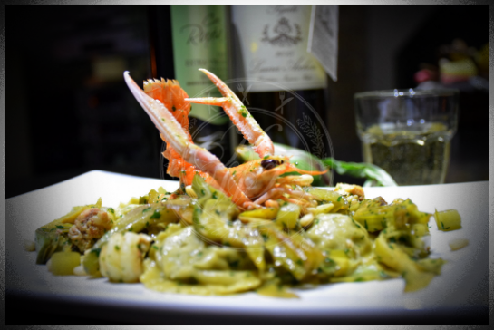 Ravioli ai carciofi con ragu di scampi e carciofi